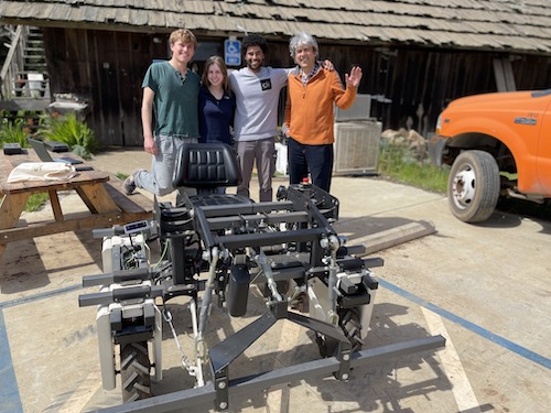 researchers pose with their autonomous tractor